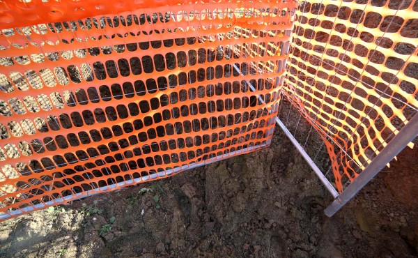 Orange safety net in a road construction site